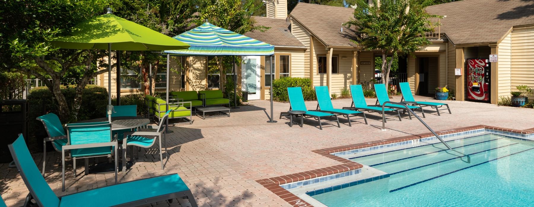 a pool with chairs around it