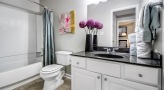 Bathroom with full sized bathtubs and large vanities