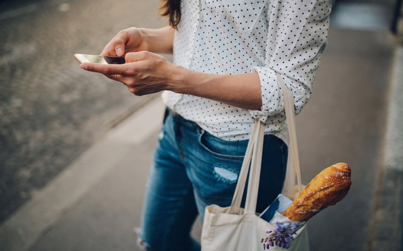 a woman holding a phone