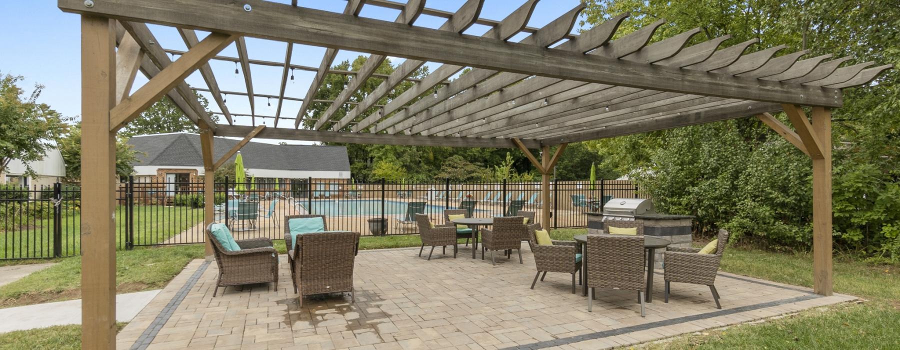 a grill area with tables and chairs