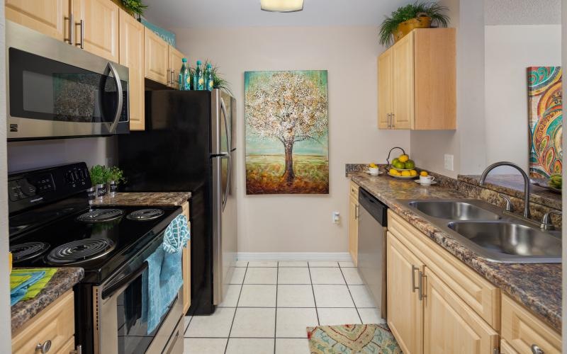a kitchen with a stove and oven