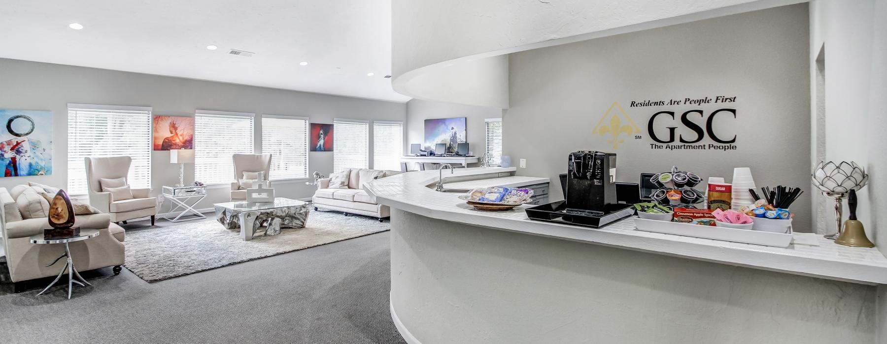 a lobby with a desk and a computer
