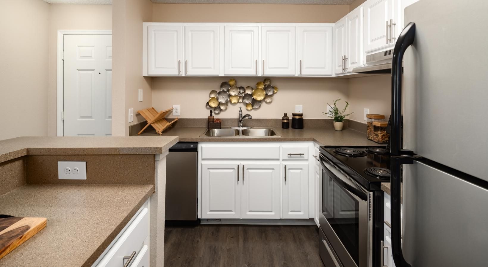 Kitchen with stainless steel appliances and breakfast bar