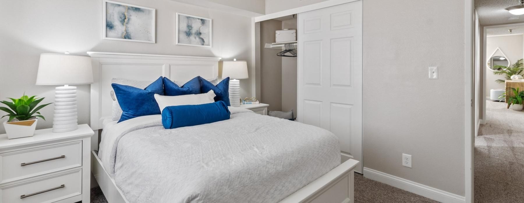 a bedroom with a bed and two nightstands