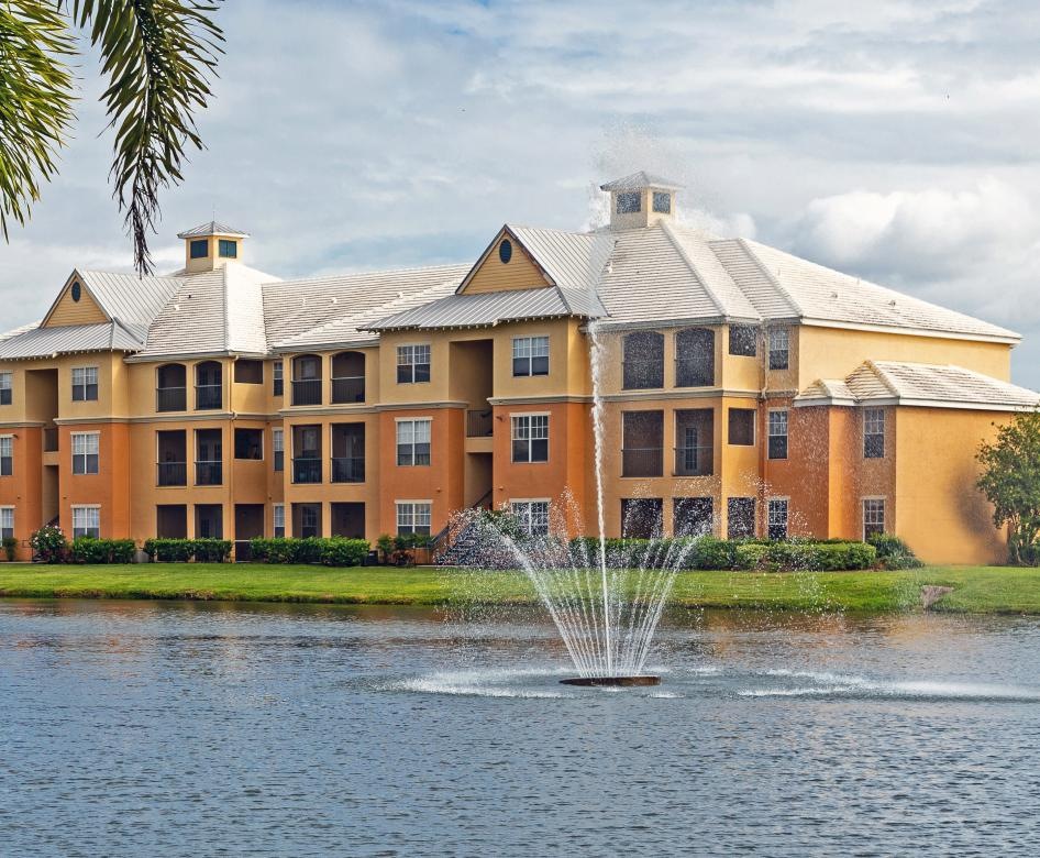 a building with a pond in front of it