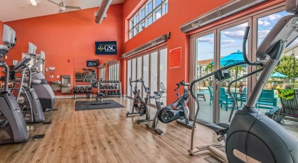 24-Hour fitness center with yoga and pilates area