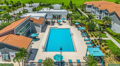 Salt-water pool with lounge seating and umbrellas