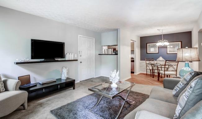 a living room with a tv and couches