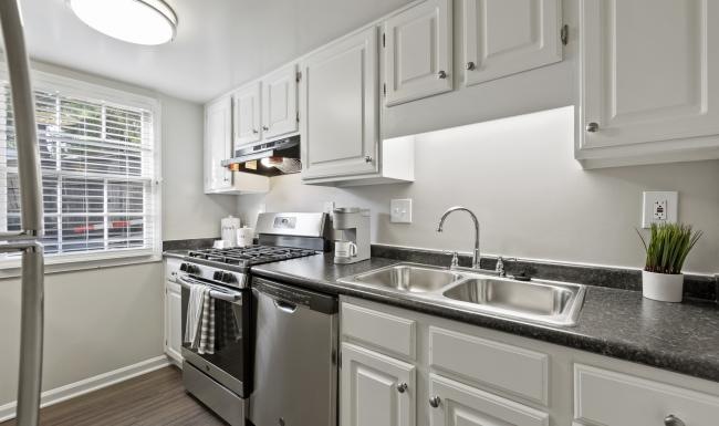 a kitchen with white cabinets
