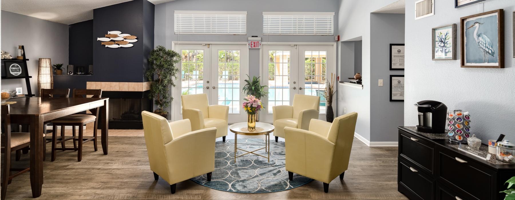 a room with a table chairs and a rug