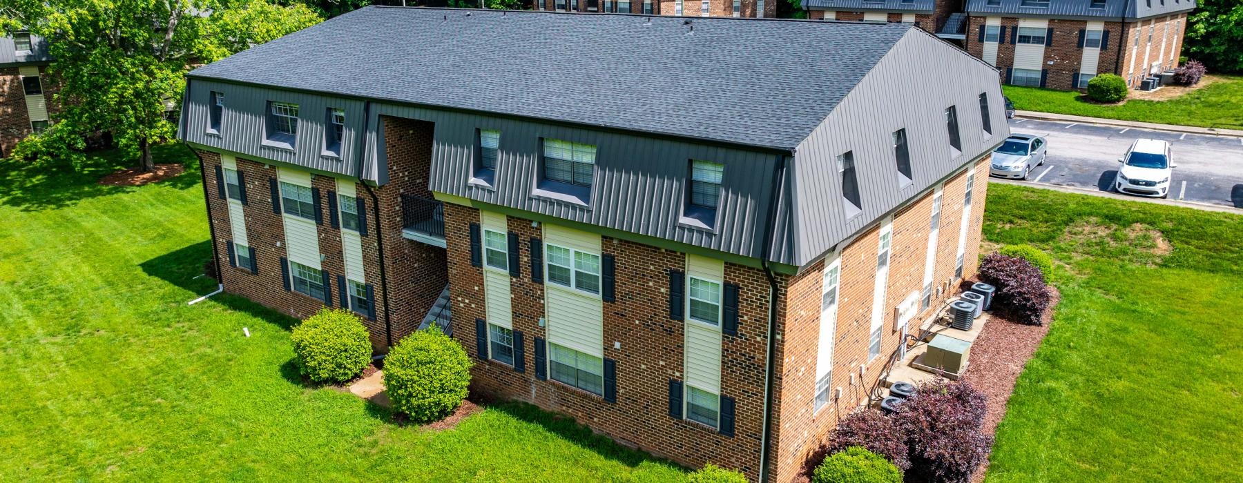 a large building on a green lawn