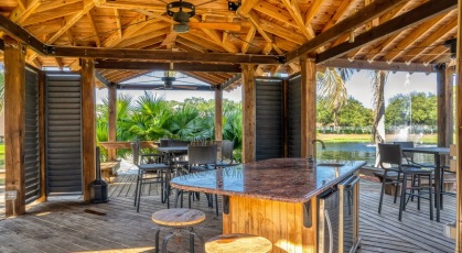 Outdoor covered lounge and grilling area