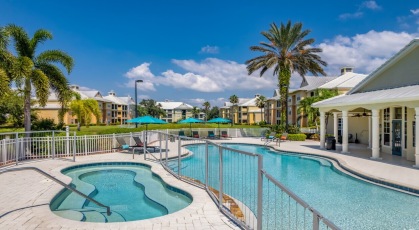 Free-form pool with sun deck and lounge chairs
