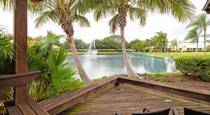 Sitting area at outdoor dining pavilion that extends outward for lake view