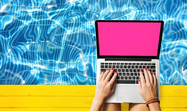 a person holding a laptop