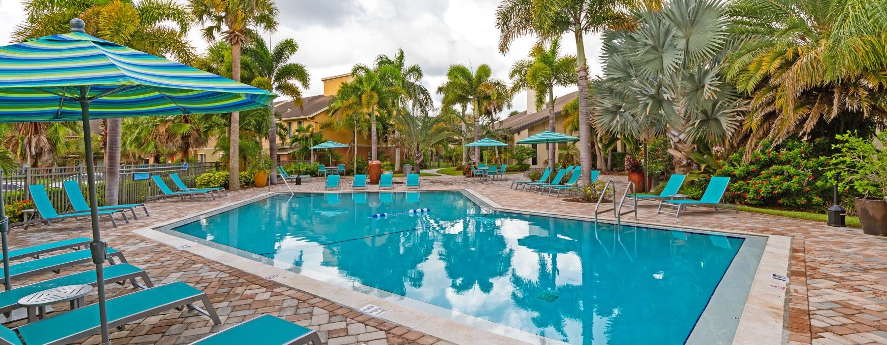 a pool with chairs around it