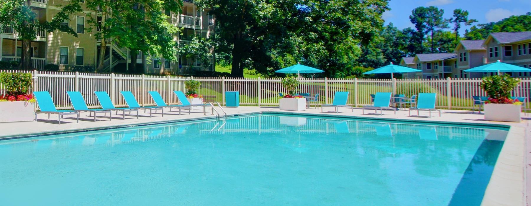 a pool with chairs around it