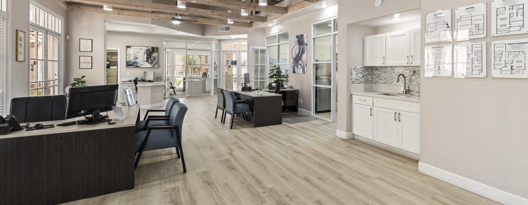 a large kitchen with a wood floor