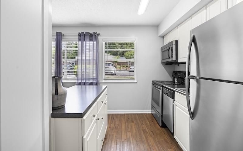 a kitchen with white cabinets