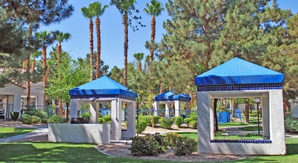 Outdoor grilling and picnic huts near pool
