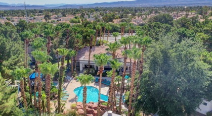 Arial view of resort style pool and well manicured grounds