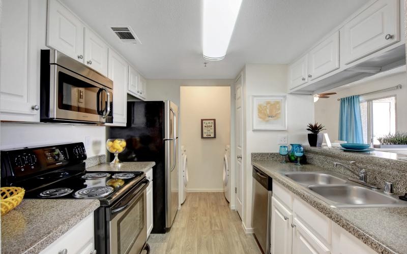 a kitchen with white cabinets