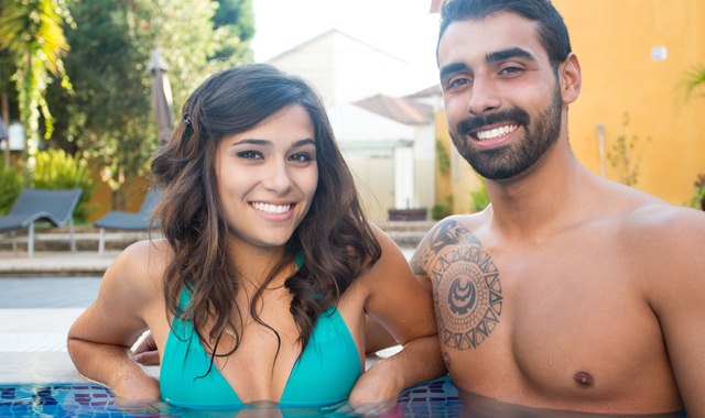 Lifestyle Image Of Couple in a Swimming Pool
