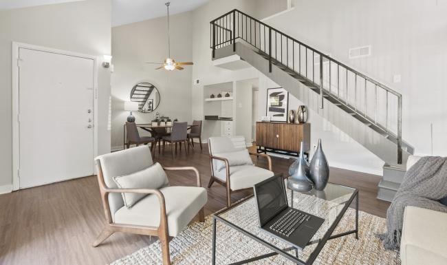 a living room with a staircase