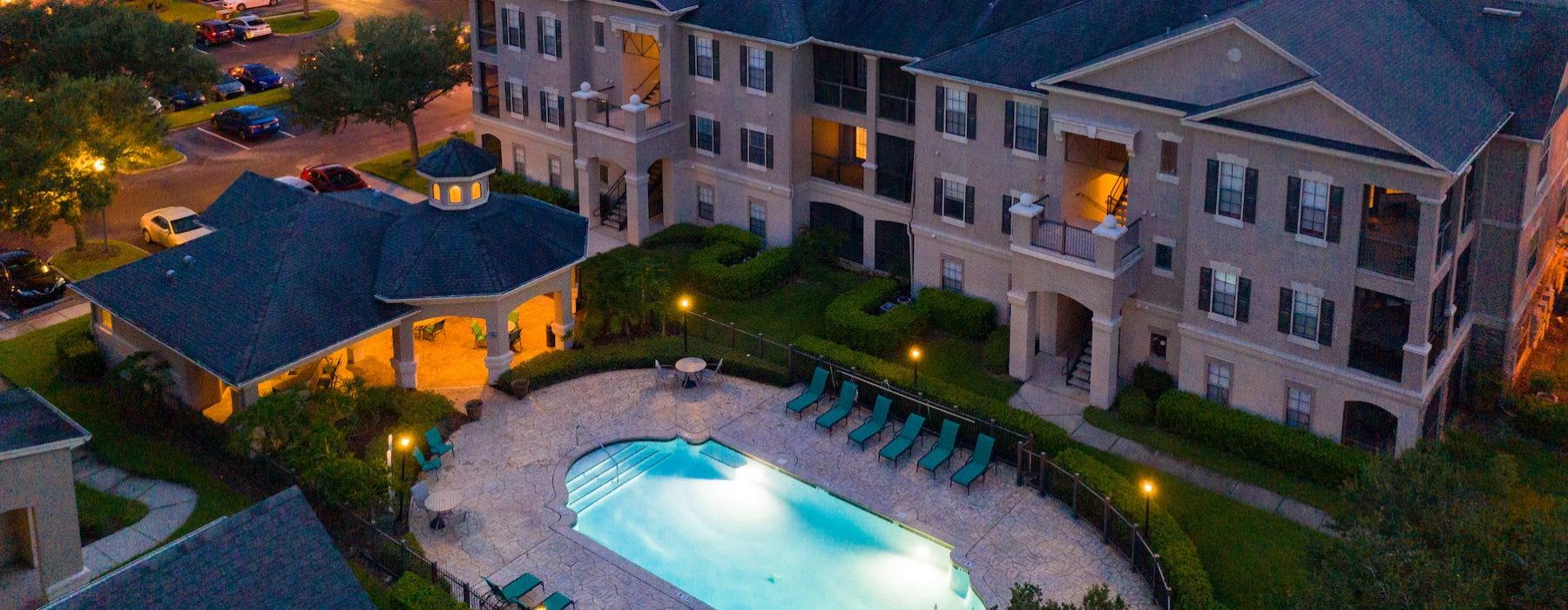 an aerial view of an apartment with a pool