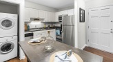 Kitchen with stainless steel appliances and built-in microwave
