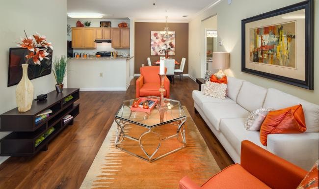 a living room with a large white couch and a table