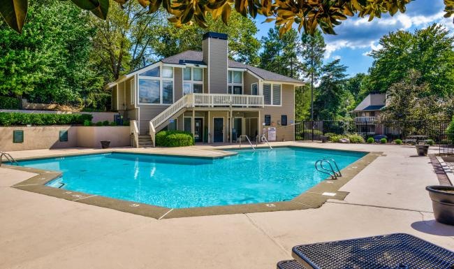 a swimming pool in front of a house