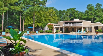 Swimming pool next to clubhouse building