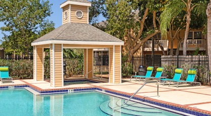 Covered hot tub next to pool