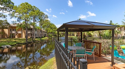  Covered seating in pool area over looking lake