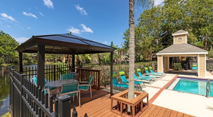 Covered seating in pool area over looking lake