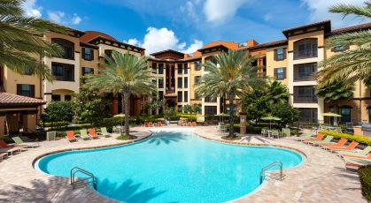 Zero entry pool surrounded by adjustable lounge chairs
