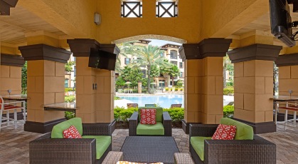 Lavish poolside cabana with tvs, patio furniture and granite countertops 