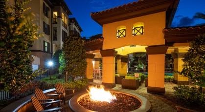 Fire pit with seating around near the pool area