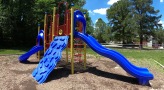 Playground with slide, ladder, and jungle gym