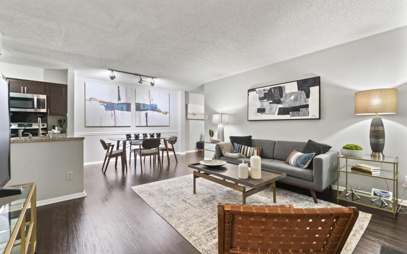 a living room with a couch and chairs