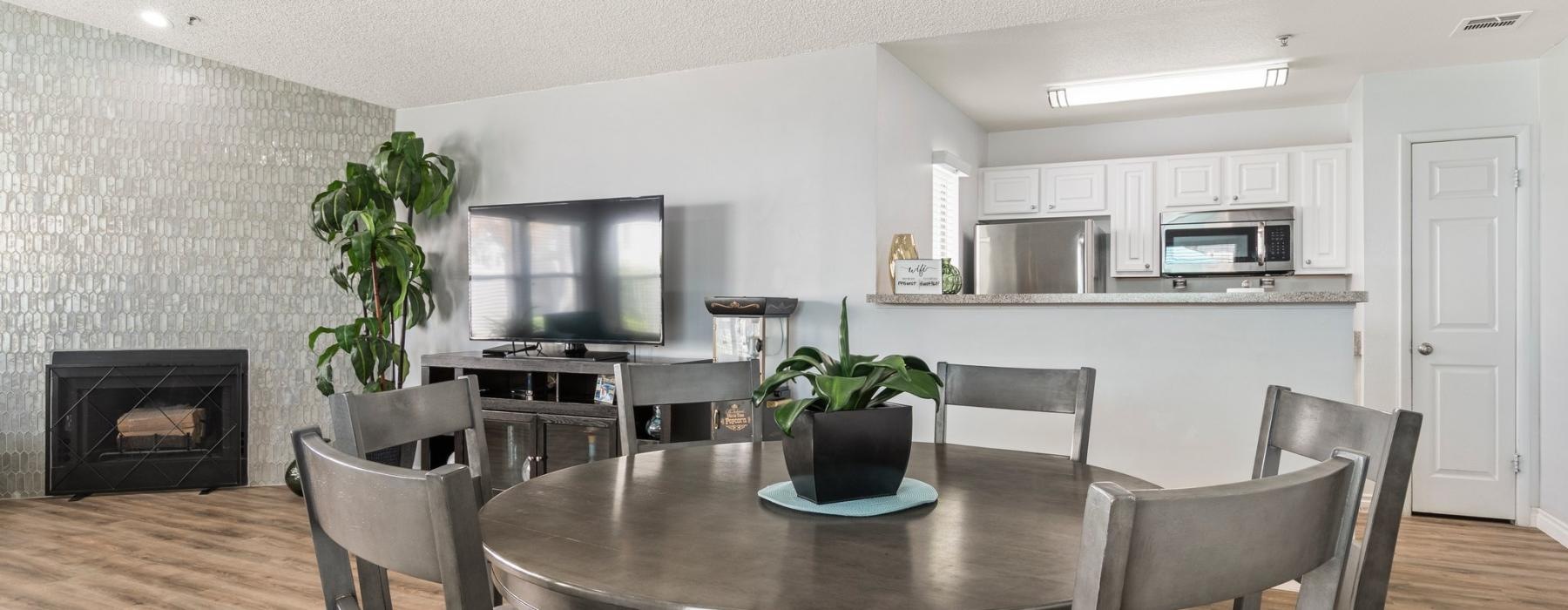 a dining room table with chairs