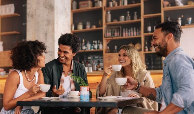 a group of people sitting around a table