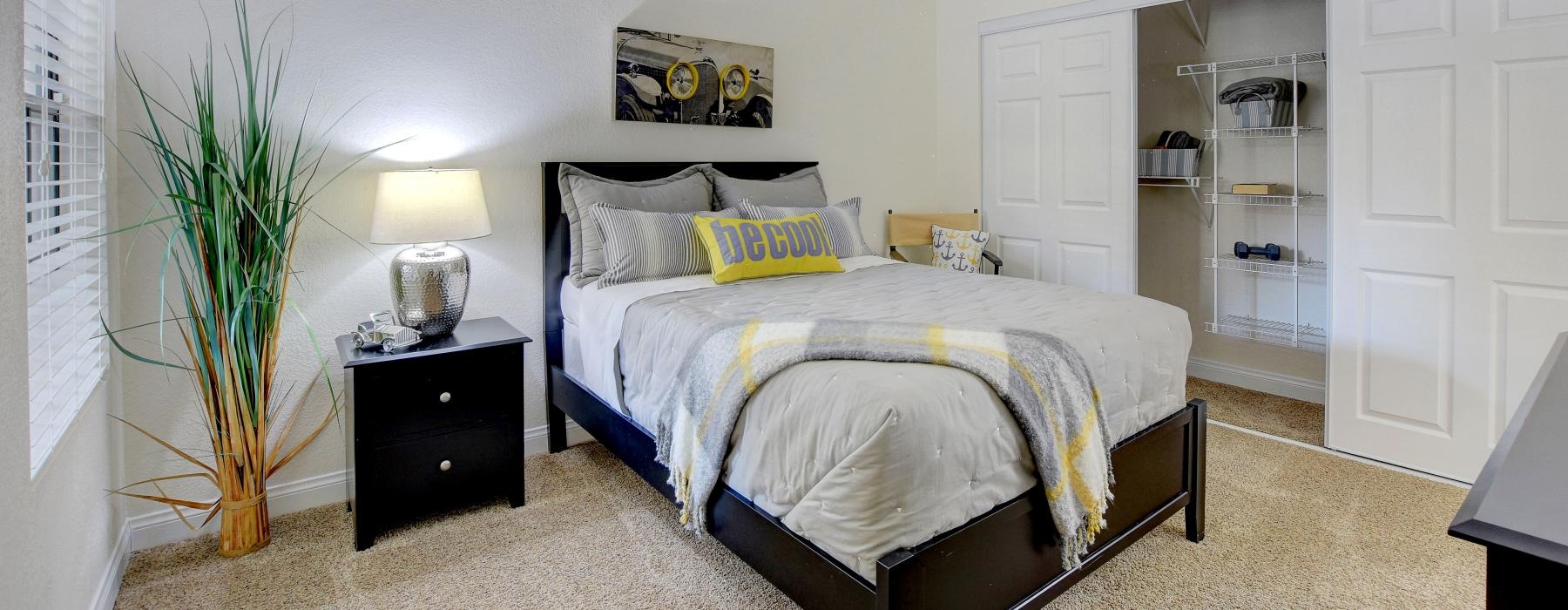 carpeted bedroom with soffit counter
