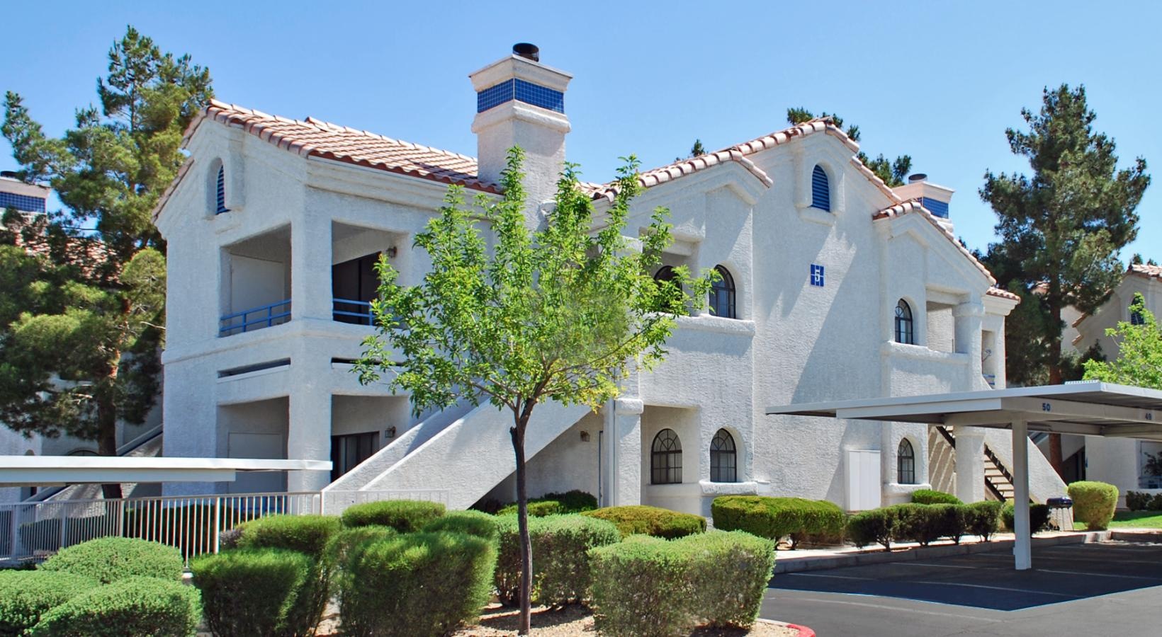 Condo-style homes with landscaped grounds