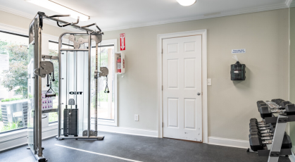 Fitness center with free weights and weight training equipment 