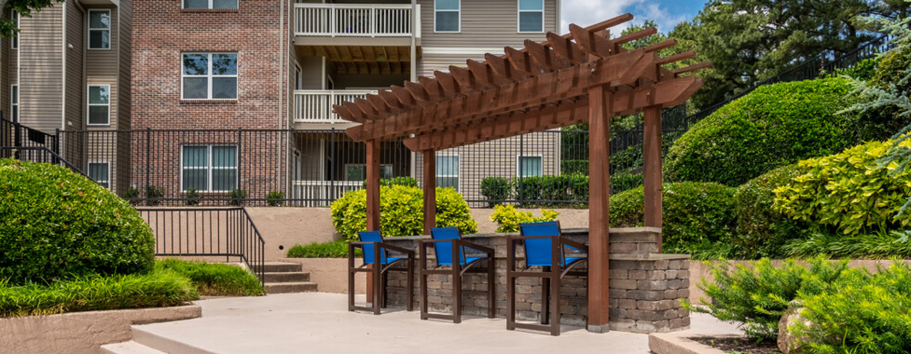 Pull up a chair at our outdoor pergola and grill