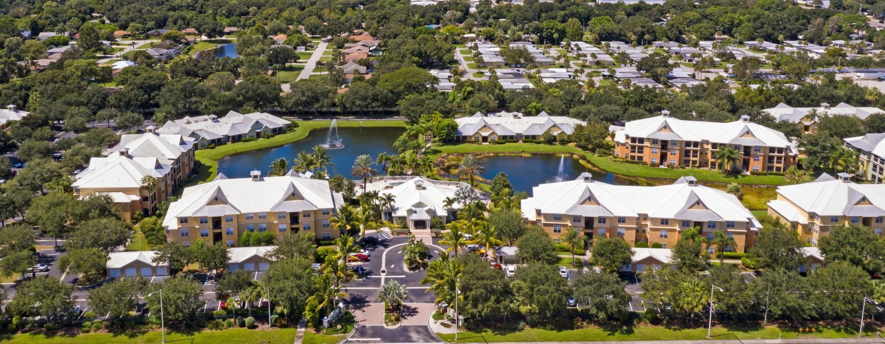 a group of buildings next to a body of water