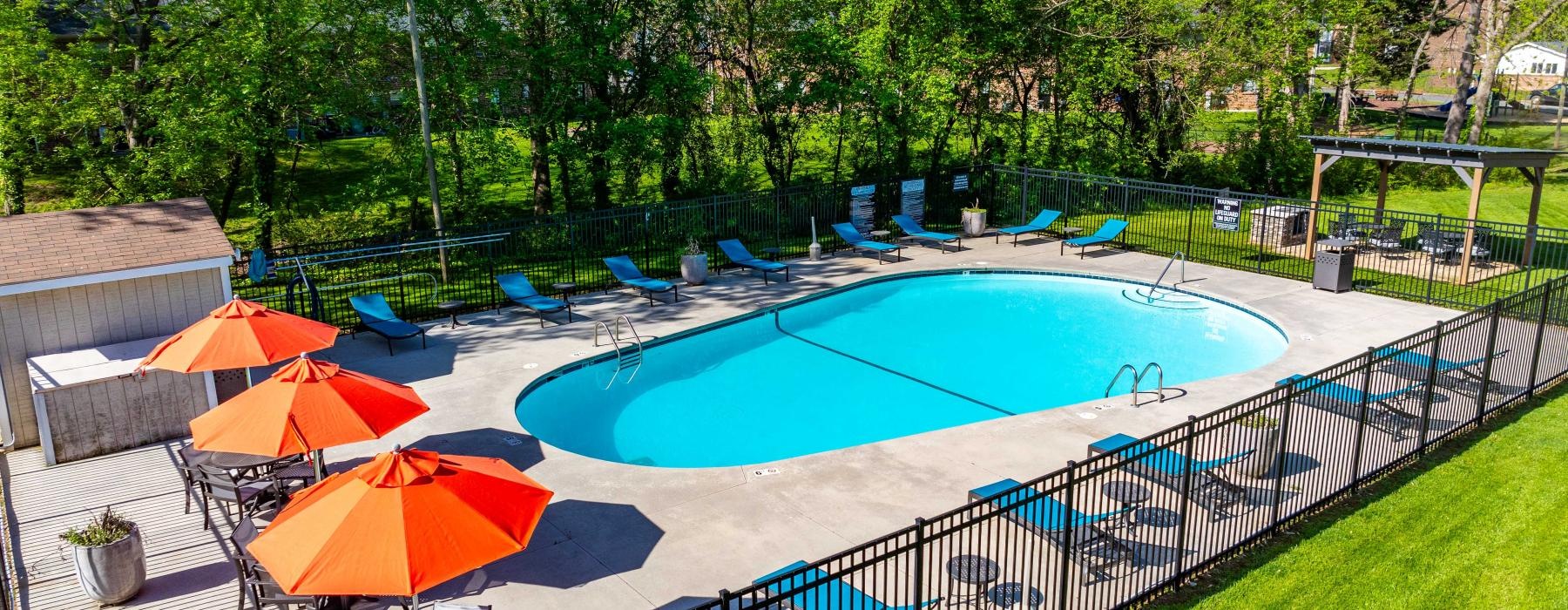 a swimming pool with umbrellas