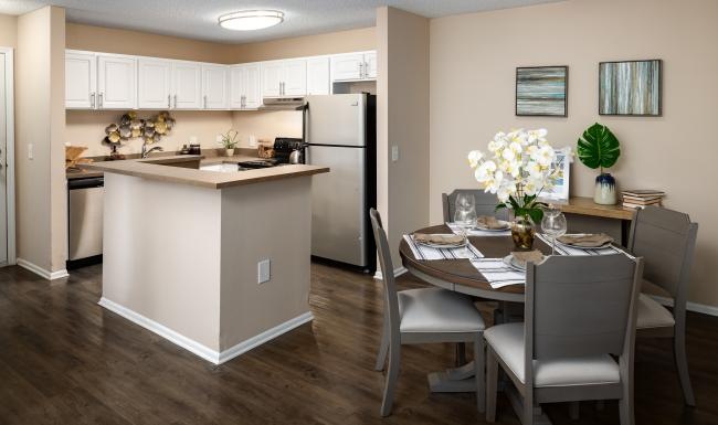 a kitchen with a table and chairs